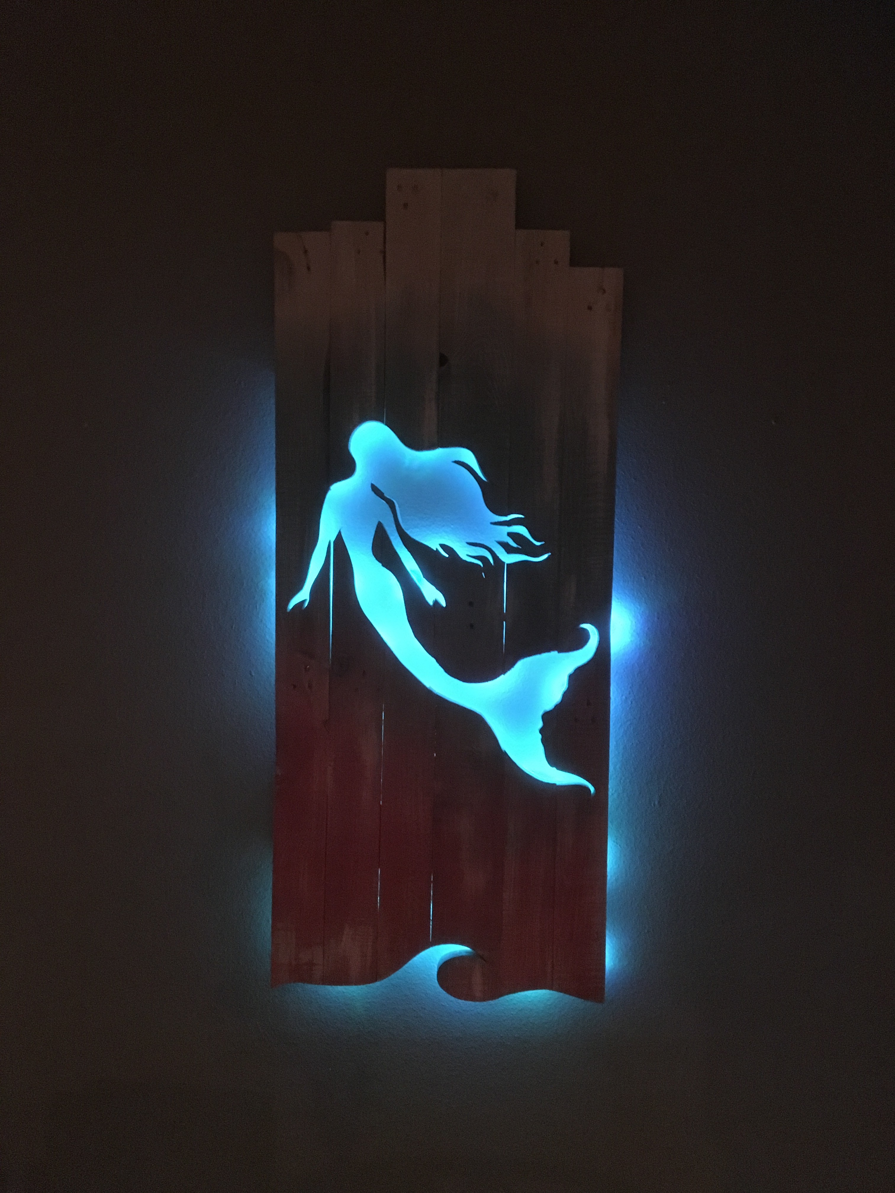 Mermaid with Multi-color lights at night