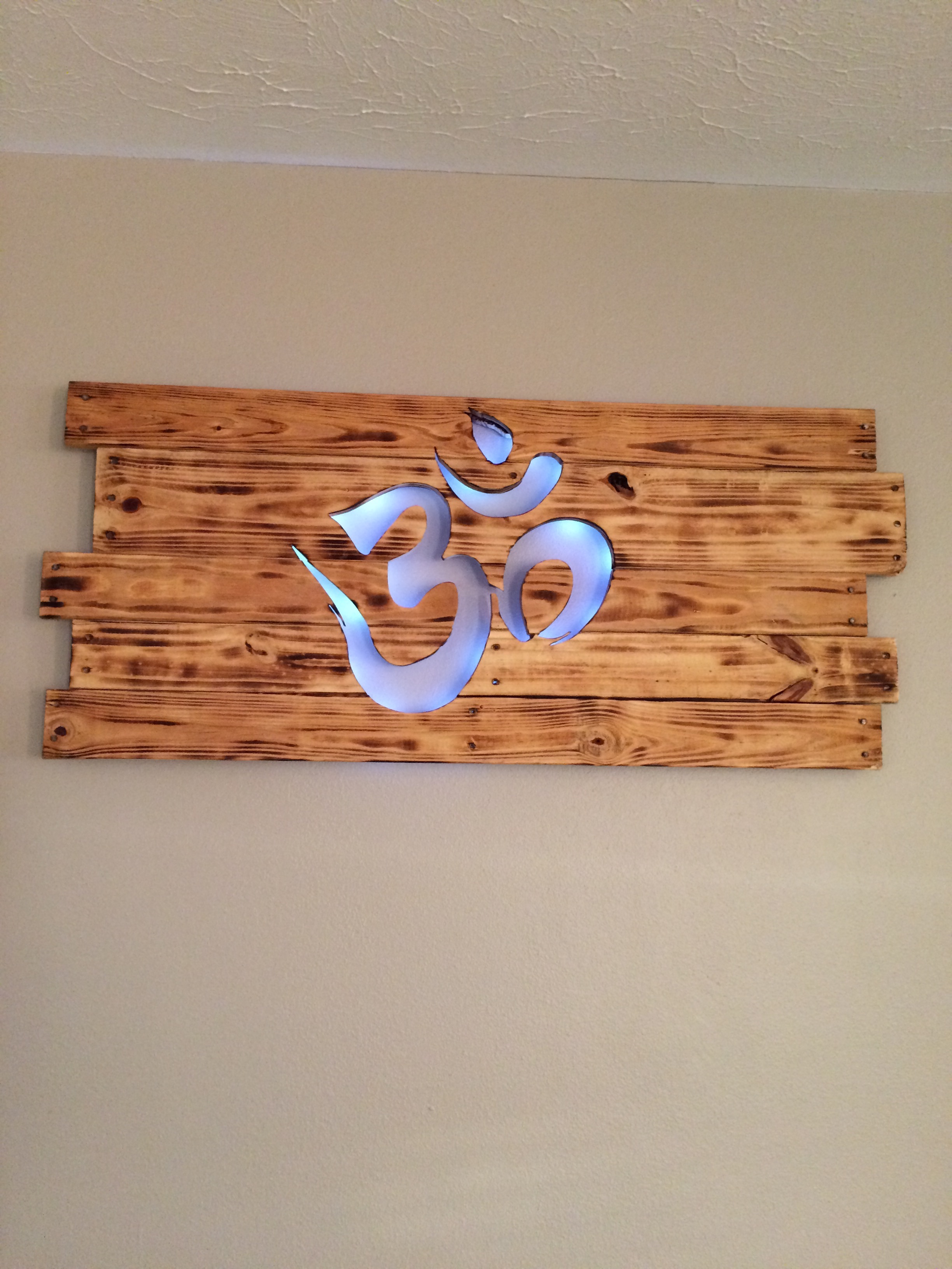 "OM" in light wood